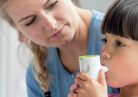 Nurse helps patient with Nebulizer